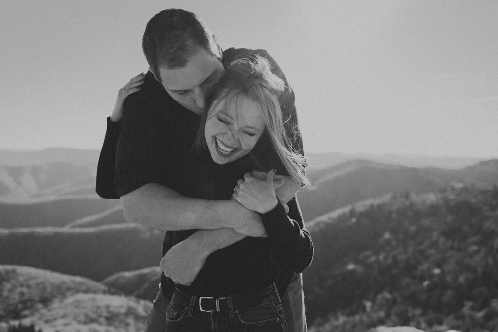 Couple embracing on mountain top