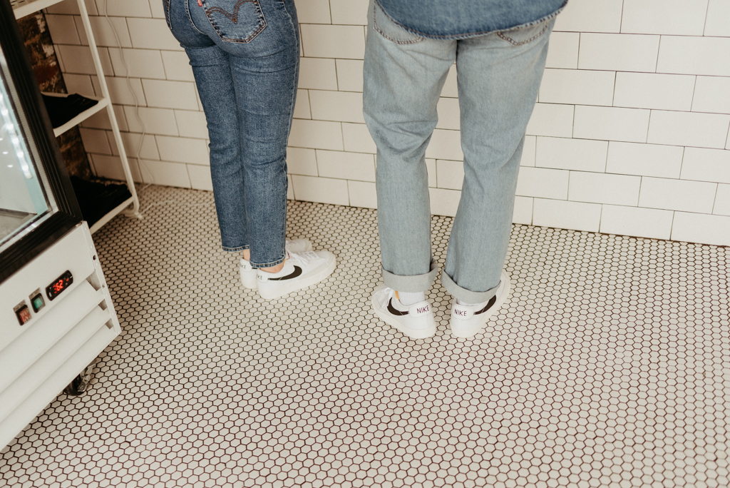Couple wearing matching Nike tennis shoes